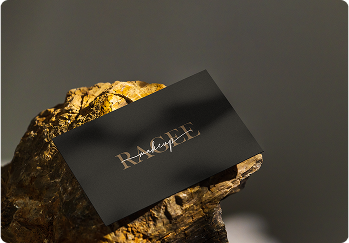 A person working on a laptop with charts on the screen