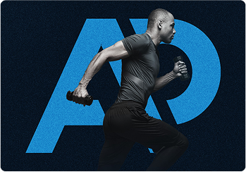 A person working on a laptop with charts on the screen