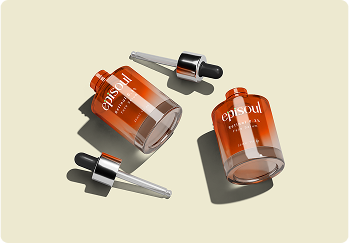 A person working on a laptop with charts on the screen